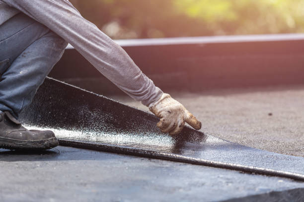 Professional Basement Waterproofing technician working in Ringle, WI